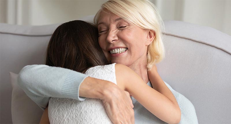 Mother hugging child