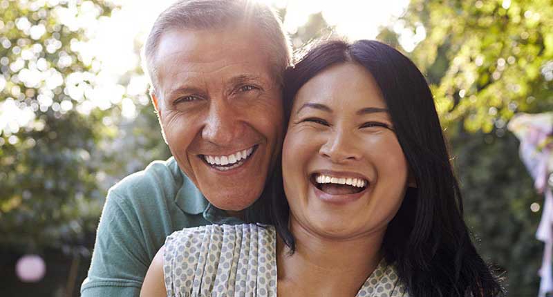 Couple smiling with dentures