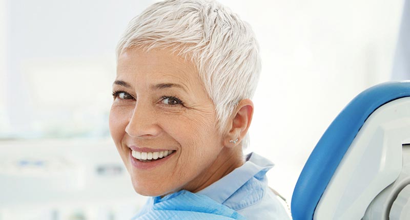 Woman smiling while in dentist chair