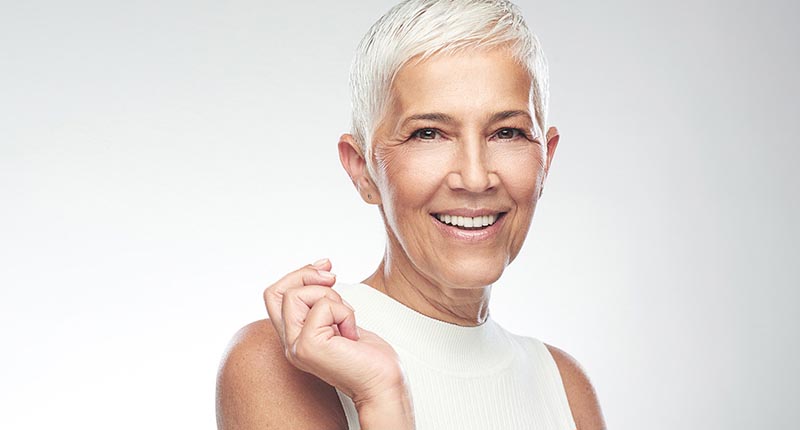 Woman in white smiling